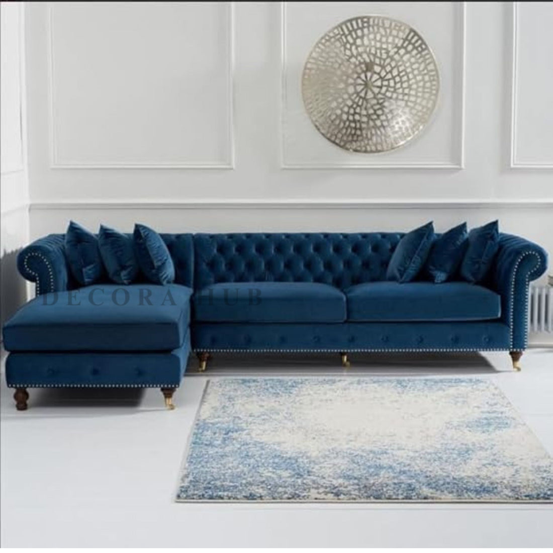 Blue Chesterfield L-shaped sofa in a living room