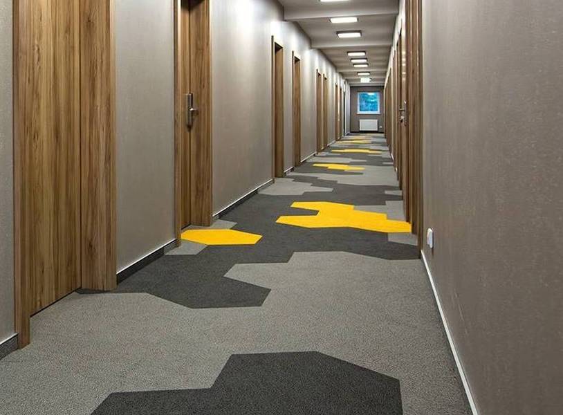Hexagon grey tile carpet laid on a floor