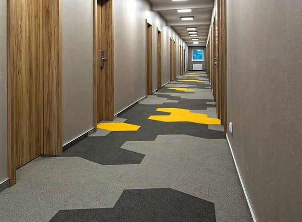 Hexagon grey tile carpet laid on a floor