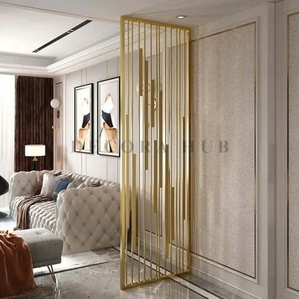 Gold metal partition dividing an Indian living room from the foyer