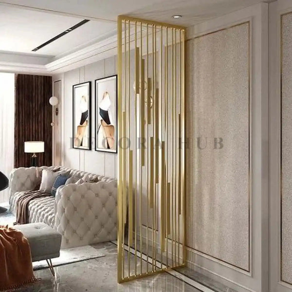 Gold metal partition dividing an Indian living room from the foyer