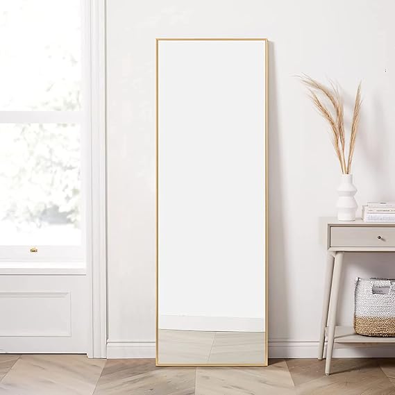 Large rectangular wall mirror above a console table