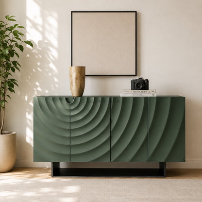 Modern green sideboard with decorative items in a room with a plant and framed picture.