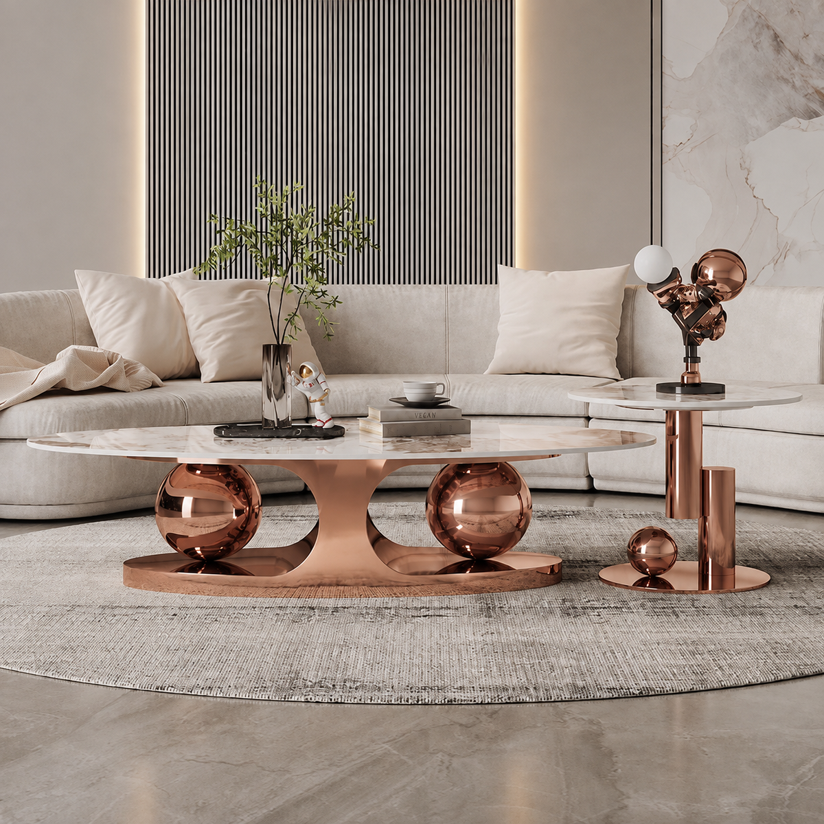 Decorahub Double ball Rose goldCopper Gold Marble top Centre tableCopper Gold Marble top Centre table centre table. A modern living room setup featuring a round coffee table with a white marble top and a sculptural copper base, alongside a matching side table with a marble top and copper pedestal base, styled with decorative objects on a gray rug. 