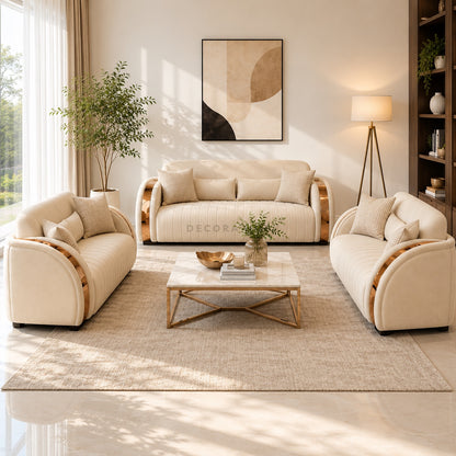 Beige sofa set in a living room with a coffee table and decorative items.