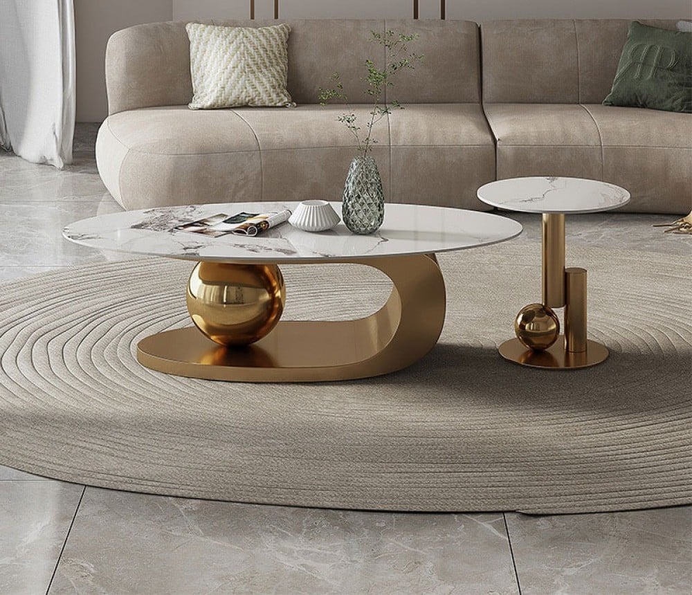 A modern living room setup featuring a Golden base Marble top centre table with Ball.