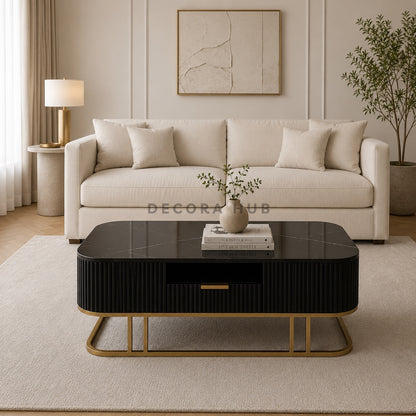 Modern living room with a beige sofa, black coffee table, and decorative elements.