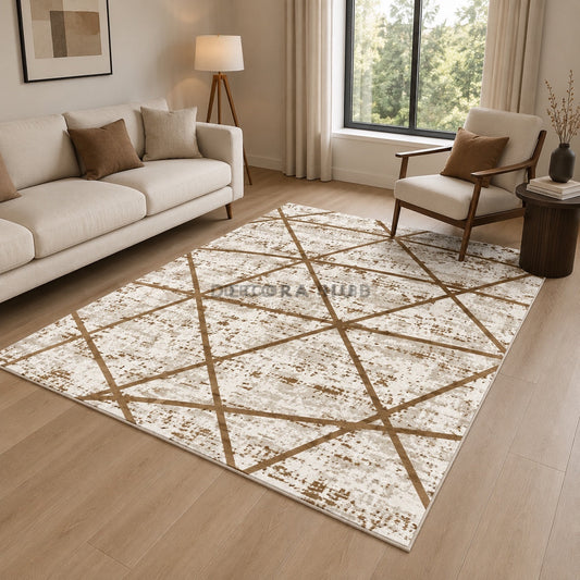 Living room with a geometric patterned rug, beige sofa, and armchair.