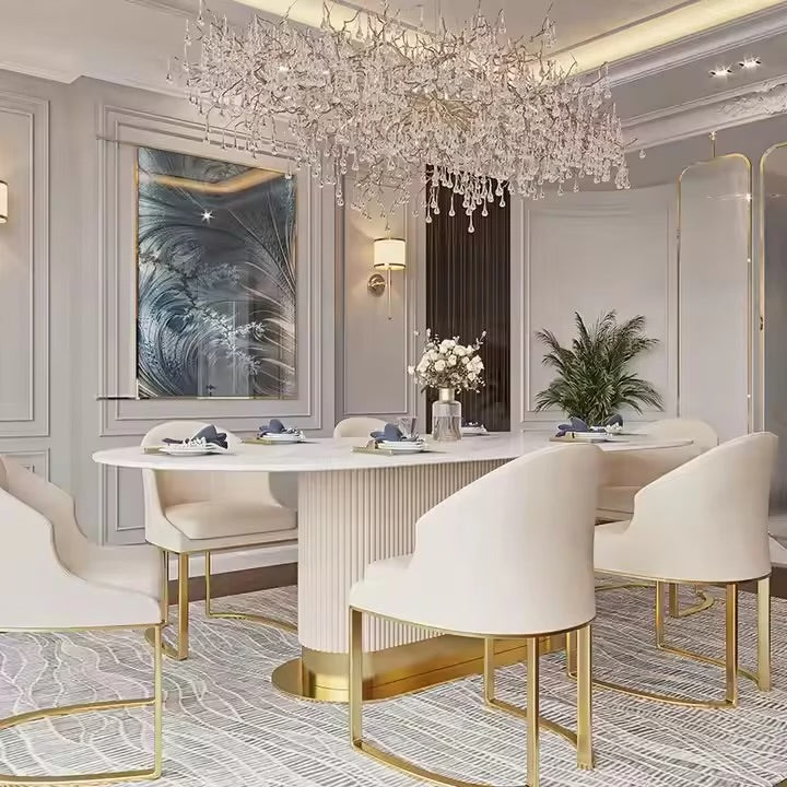 Elegant dining room with a chandelier, table, and chairs.