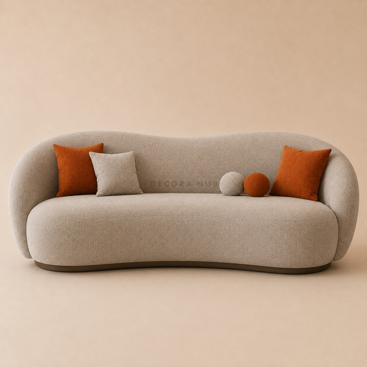 Beige sofa with orange and gray cushions on a beige background