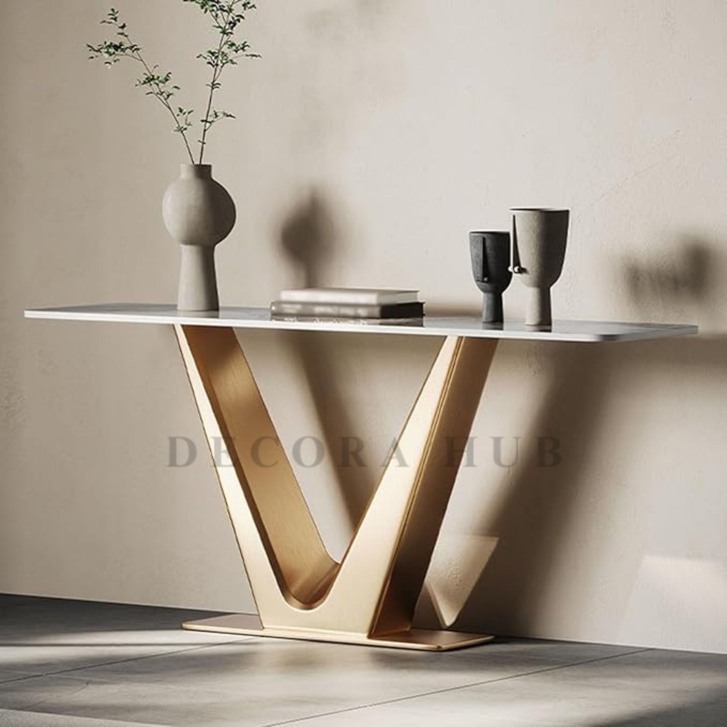 V Luxurious Console Table with white composite marble top and gold PVD coated stainless steel frame.