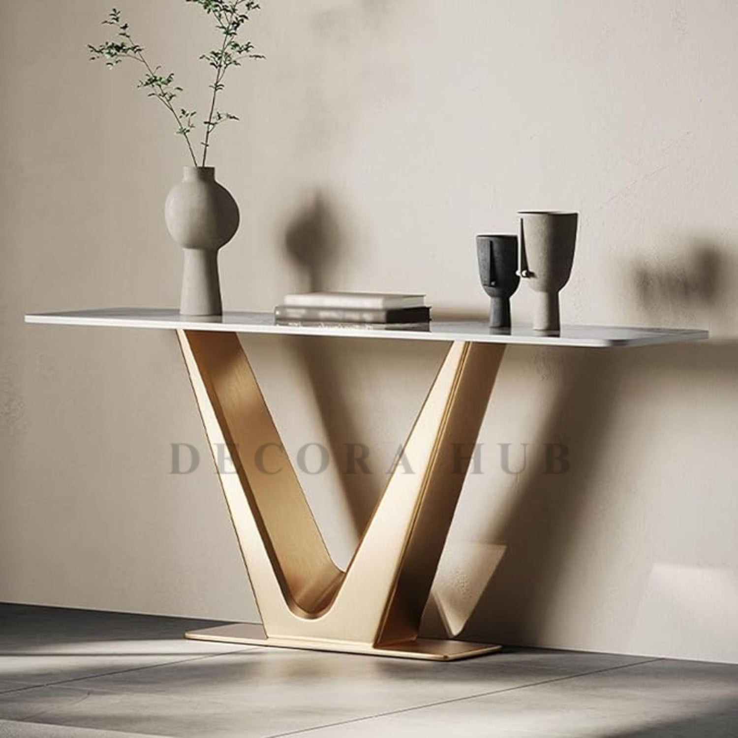 V Luxurious Console Table with white composite marble top and gold PVD coated stainless steel frame.