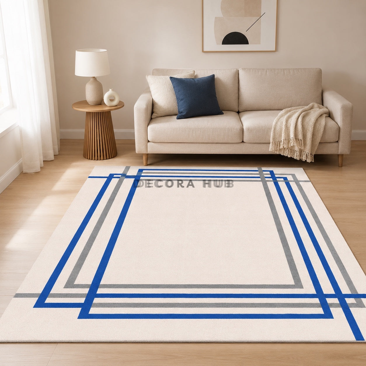 Living room with a beige sofa, blue pillow, and a large geometric-patterned rug.
