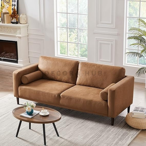 -seater sofa with curved arms and plush upholstered cushions in a modern living room